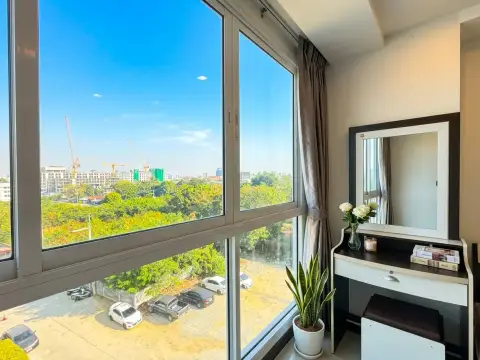 1 Bedroom Condo for Sale at Novana Residence bedroom window view of city skyline and construction cranes