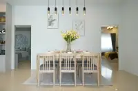 3 Bedroom House for Sale at Phonthep Garden Ville 2 dining room with large wood table eight chairs and pendant lights