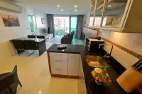 2 Bedroom Condo for Sale & Rent at Laguna Heights kitchen island with granite counter overlooking dining and living space