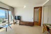 1 Bedroom Condo for Rent at Northpoint bright living room with floor-to-ceiling sliding doors and sea view balcony