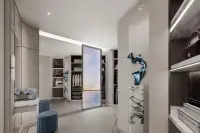 3 Bedroom Condo for Sale at Aquarous Jomtien Pattaya spacious walk-in wardrobe with built-in shelves, floor mirror, and blue sculpture