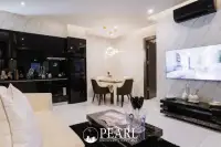 2 Bedroom Condo for Sale in Grand Solaire Pattaya master bedroom with king-size bed and city view