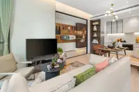 1 Bedroom Condo for Sale at Once Wong Amat living room with beige sofa flat-screen TV and open-plan kitchen and dining area