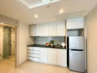 1 Bedroom Condo for Sale at Novana Residence kitchen with white cabinets, stove and refrigerator