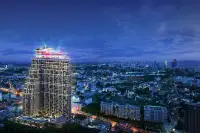 2 Bedroom Condo for Sale at Grand Solaire Noble master bedroom with balcony city view and marble accent wall