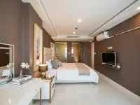 1 Bedroom Condo for Sale at Grand Avenue Residence bedroom with king bed and glass-enclosed ensuite bathroom