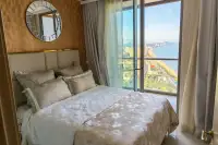 1 Bedroom Condo for Rent at Copacabana Beach Jomtien bedroom with round mirror and panoramic sea view