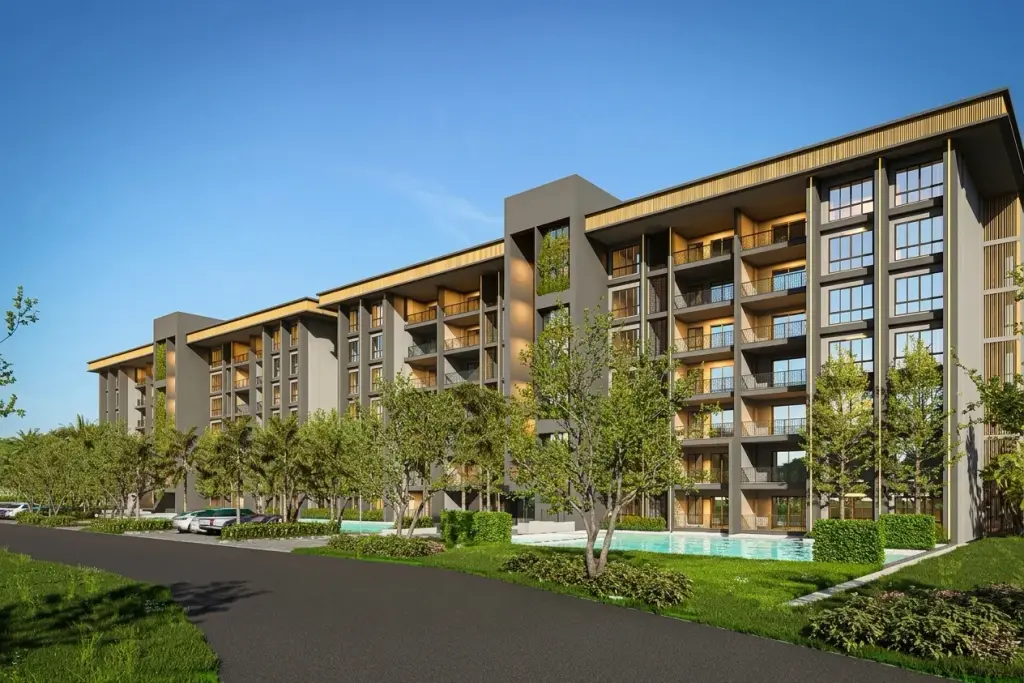 Zensiri Estates and Residences modern condo building with balconies, lush landscaping, and a swimming pool.