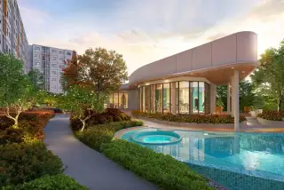 Dcondo Vale Sriracha fitness center and jacuzzi pool beside landscaped garden path at dusk