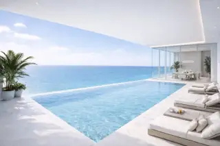 Sea Sky private infinity pool with white sun loungers and unobstructed turquoise sea view