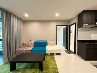 1 Bedroom Condo for Sale at The Ocean Pearl outdoor swimming pool with loungers and poolside seating