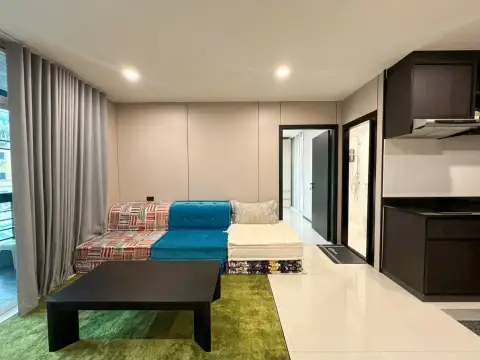 1 Bedroom Condo for Sale at The Ocean Pearl outdoor swimming pool with loungers and poolside seating