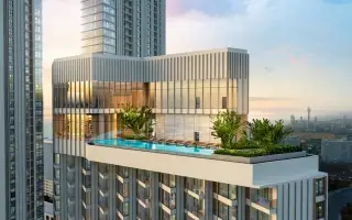 SKYPARK Lucean Jomtien Pattaya rooftop sky pool with lounge chairs and city skyline view at dusk.