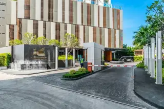 Marina Bayfront Sriracha entrance driveway with security gate and signage