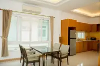 6 Bedroom House for Sale & Rent at Amorn Village, open-plan dining area with kitchen in the background.
