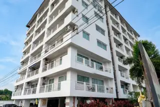 Jomtien Beach Mountain 2 private patio with terracotta tiles, outdoor seating, small pool, and lush garden.