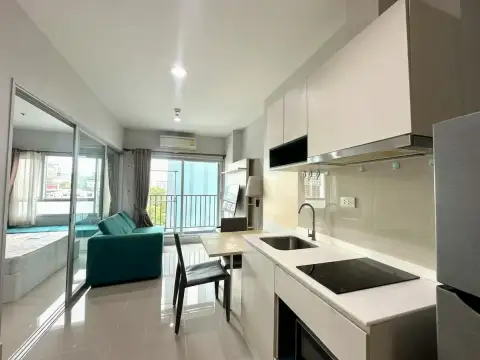 1 Bedroom Condo for Sale at Centric Sea kitchenette with countertop stove, sink, and living area view