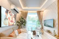 2 Bedroom Condo for Sale at The Riviera Santa Monica living room with sofa, large artwork, and view of outdoor pool.
