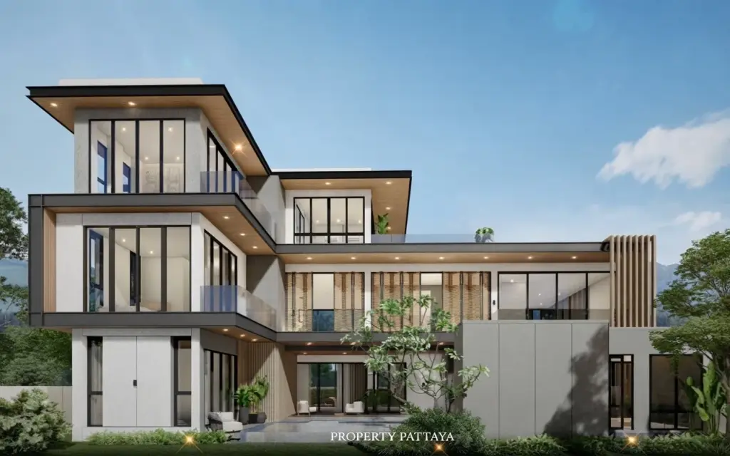 Resta Villa Mabprachan modern multi-story house exterior with large glass windows, balconies, and landscaping under a clear sky.