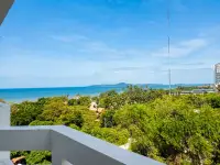 Studio Condo for Sale at Jomtien Condotel & Village panoramic ocean and tropical treetop view from balcony