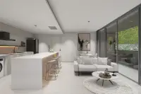 2 Bedroom Condo for Sale at Celine Wongamat open-plan kitchen with white island, bar stools, and living room with garden balcony