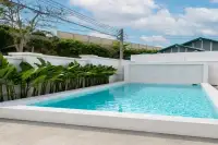 3 Bedroom House for Sale at Paradise Hill 2 private outdoor swimming pool with turquoise water and tropical plant border