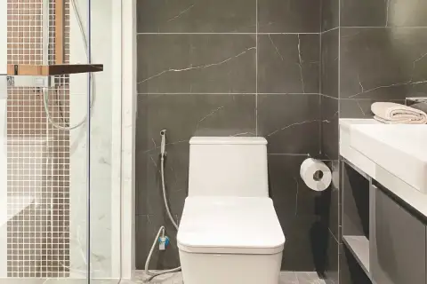 Studio Condo for Sale at Pristine Park 3 bathroom with toilet, handheld bidet, and mosaic tile shower