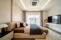 4 Bedroom House for Sale at Horizon By Patta master bedroom with leather platform bed, TV unit and large window