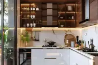 3 Bedroom Condo for Sale at The Riviera Palm Beach modern kitchen with white gloss cabinets, marble backsplash, and walnut open shelving