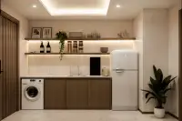2 Bedroom Condo for Sale at Siam Oriental Beach: modern kitchenette with white retro fridge, washing machine, sink, and illuminated shelves.
