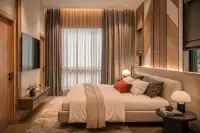 3 Bedroom House for Sale at Spectra Residence master bedroom with wood-panel feature wall, king bed, and floor-to-ceiling curtains