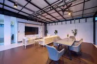 3 Bedroom House for Sale in Nong Prue covered outdoor sala with wicker sofa set, dining table, ceiling fans and marble-panel TV wall