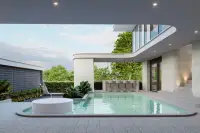 5 Bedroom House for Sale at Gravity Prime Pattaya outdoor swimming pool with integrated lounge and bar.