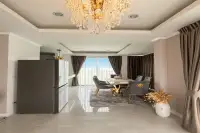 3 Bedroom House for Sale at Villa Asiatic elegant dining room with crystal chandelier and gold-accented furniture