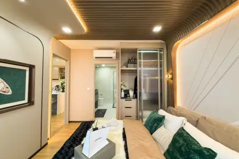 2 Bedroom Condo for Sale at Aquarous Jomtien Pattaya hallway connecting living room and bedroom with floor-to-ceiling curtains and balcony view
