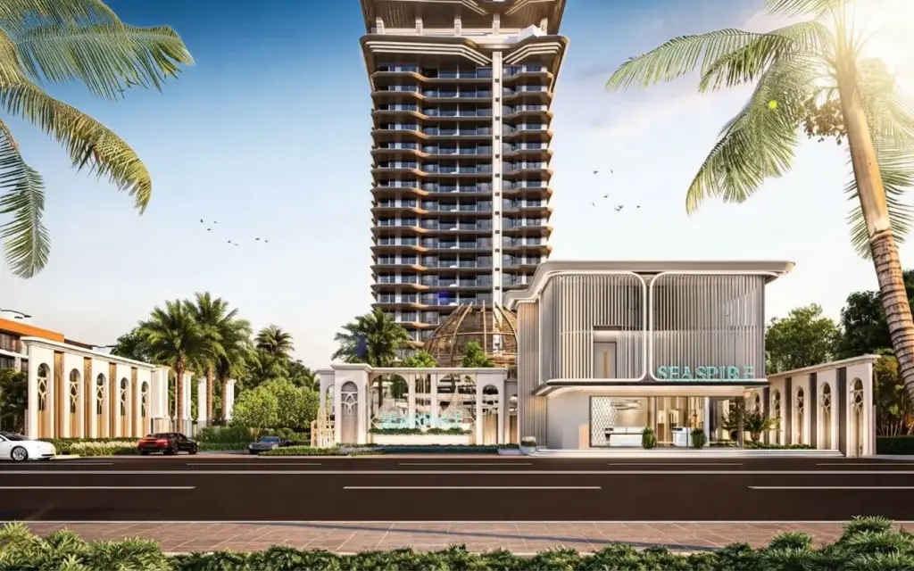 Seaspire Jomtien modern condo building exterior with palm trees, entrance, and road under a sunny sky.
