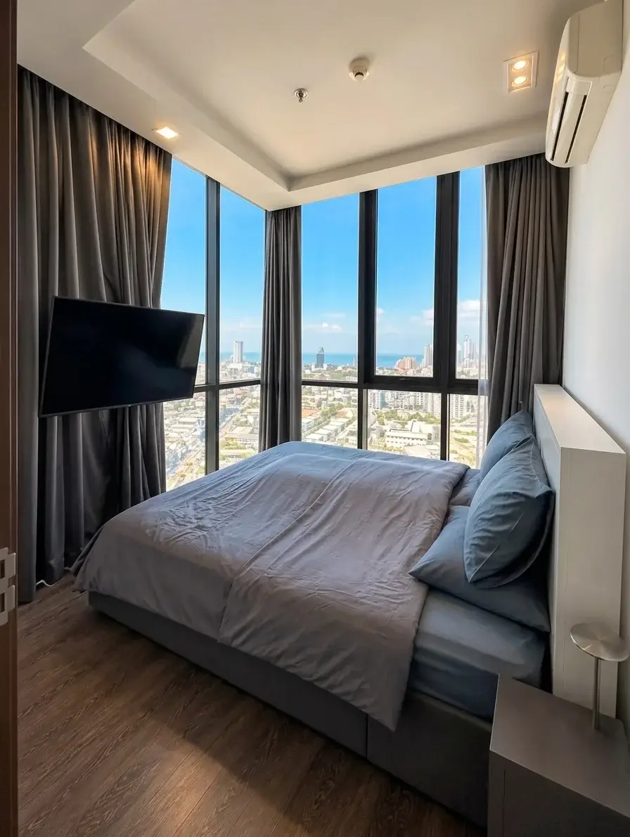 2 Bedroom Condo for Sale at Pattaya Posh bedroom with floor-to-ceiling windows and panoramic sea view