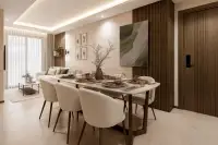 2 Bedroom Condo for Sale at Siam Oriental Beach: elegant dining area with set table and chairs, leading to a bright living room.