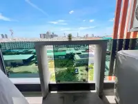 1 Bedroom Condo for Sale at MaxxCity Condo balcony view overlooking Pattaya cityscape and rooftops