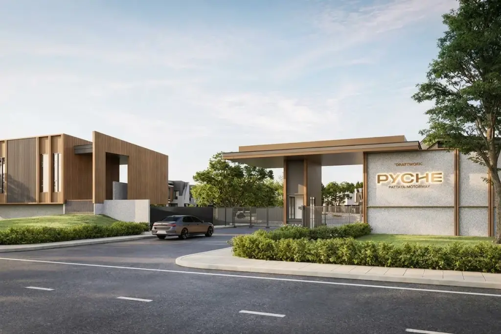 PYCHE Pattaya – Motorway main entrance gate with a modern sign, security booth, and a car entering the property.