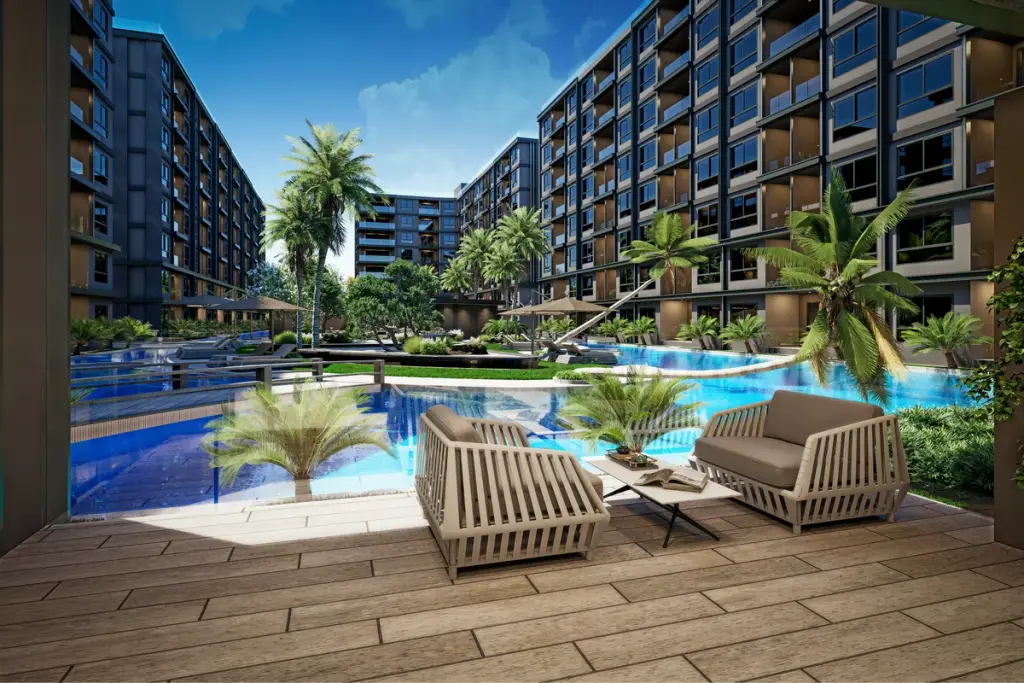 3 Bedroom Condo for Sale at Zenith 2 poolside lounge chairs overlooking lagoon pool and palm trees
