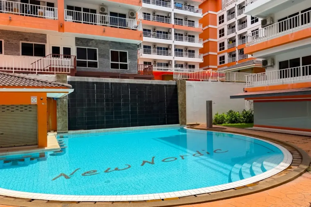 New Nordic Trend 2 curved outdoor swimming pool with name tiled on pool floor in Pattaya