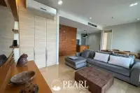 1 Bedroom Condo for Sale in Reflection Jomtien Beach living room with sofa and TV