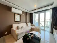 1 Bedroom Condo for Sale at Grand Avenue Residence living room with sofa bed and city-view balcony