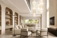 4 Bedroom House for Sale at Patta Riverine two-storey exterior facade with covered carport and three parked cars