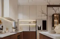 3 Bedroom House for Sale at Solava Pattaya kitchen with stone backsplash, under-cabinet lighting, wood cabinetry, and built-in fridge