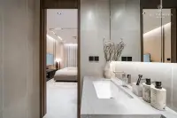 1 Bedroom Condo for Sale at Panora Estuaria: Kitchen dining bar with place settings, leading to a vanity area.