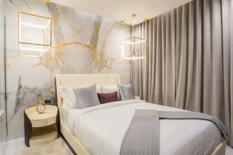 1 Bedroom Condo for Sale at Grand Solaire Pattaya bedroom with marble feature wall and gold cube pendant lights