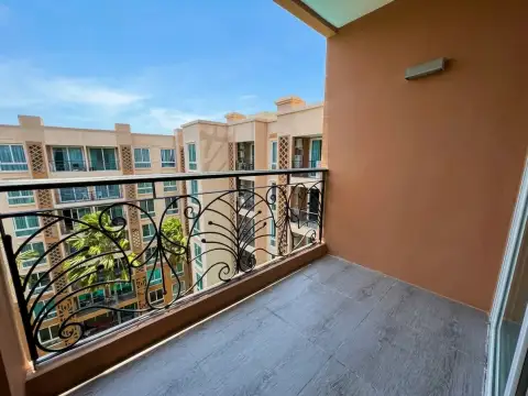 1 Bedroom Condo for Sale at Atlantis Condo Resort balcony with wrought iron railing overlooking courtyard buildings