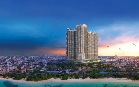 Copacabana Coral Reef beach club with a lagoon pool, sun loungers, and tropical landscaping.